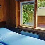 Het Houten Boshuisje